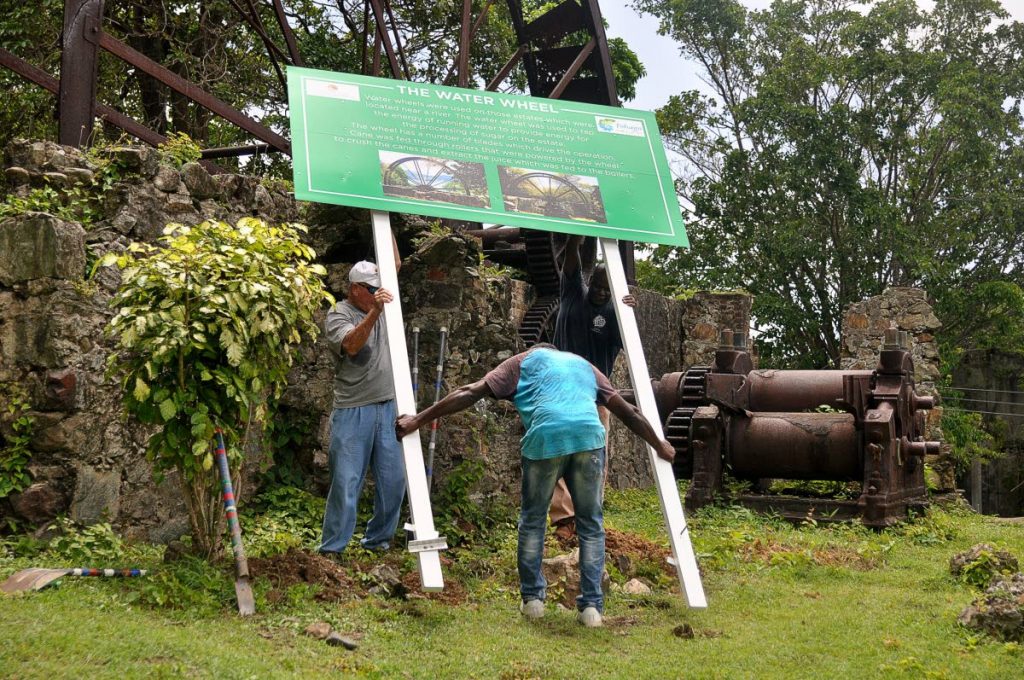 Workmen install signage at the Speyside Water Wheel on August 2.