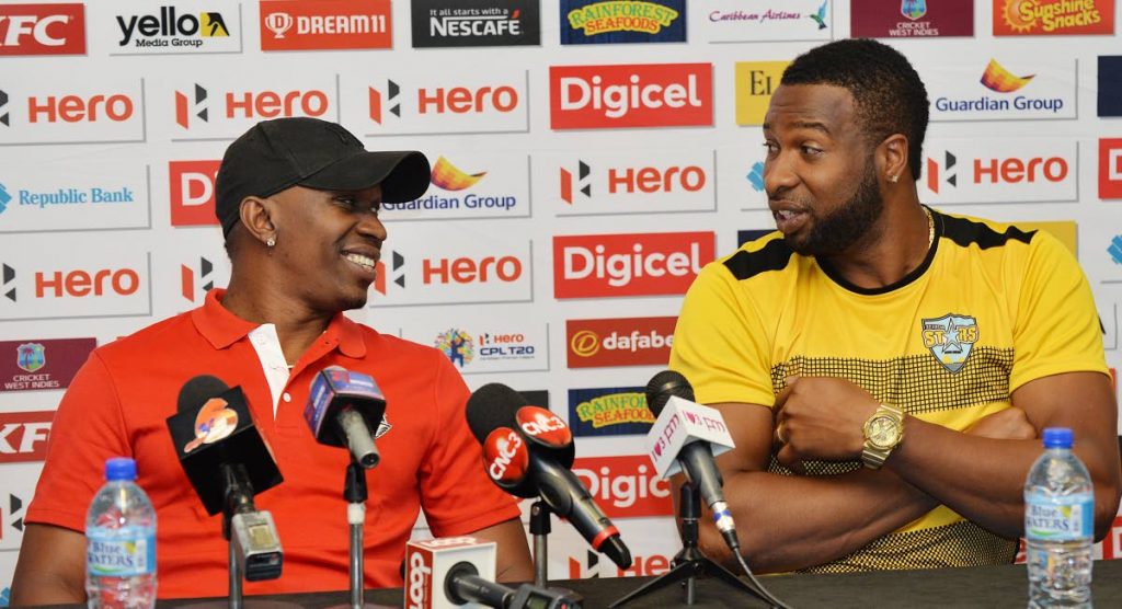 READY TO RUMBLE: Trinbago Knight Riders' Dwayne Bravo, left, engages in picong with new St Lucia Stars skipper Kieron Pollard at a press conference held at the Hyatt Regency, Port of Spain, yesterday. 