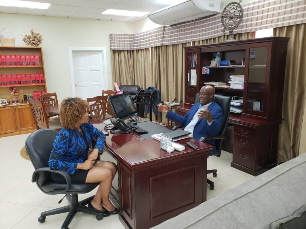 Back to work. Prime Minister Dr Keith Rowley meeting with Minister of State in the Office of the Prime Minister Ayanna Webster-Roy at his office in Scarborough yesterday.  PHOTO COURTESY OFFICE OF THE PRIME MINISTER
