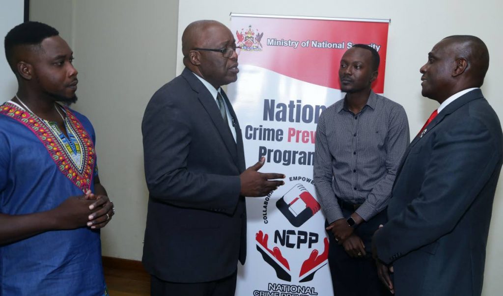 From left, Wade David, President of the Canaan/Bon Accord Village Council, stands with Chief Secretary Kelvin Charles, Assemblyman Ancil Dennis - THA’s representative on the Inter-Ministerial Committee of the NCPP Council, and Retired Major General Rodney Smart, National Coordinator of the National Crime Prevention Programme at the first public consultation in Tobago last Tuesday evening at the Canaan/Bon Accord community centre.