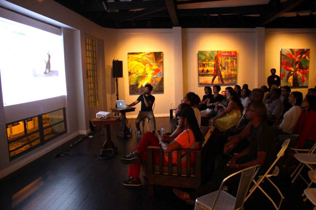 Che Lovelace speaking at his artist talk at Loftt Gallery, Rosalino Street, Woodbrook, Port of Spain, August 8.