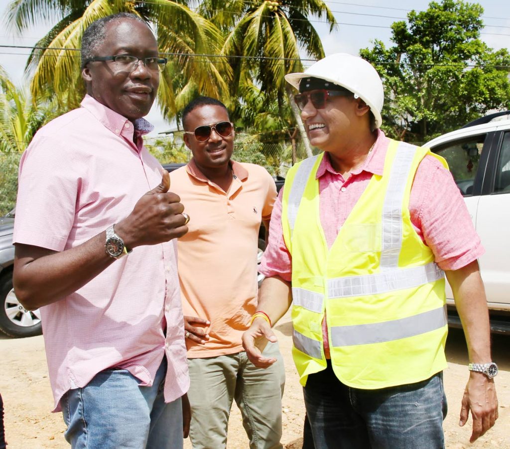 Thumbs UP: MP for La Horquetta /Talparo Maxie Cuffie, left, gives a thumbs up yesterday as he arrived on his first assignment at Manuel Congo, La Horquettea since returning home after being Hospitalised in the United States from a stroke. Cuffie was in company of Minister of Works and Transport Rohan Sinanan, right, as both toured the La Horquetta/Talparo area to get an update on bridges being built and road repairs.