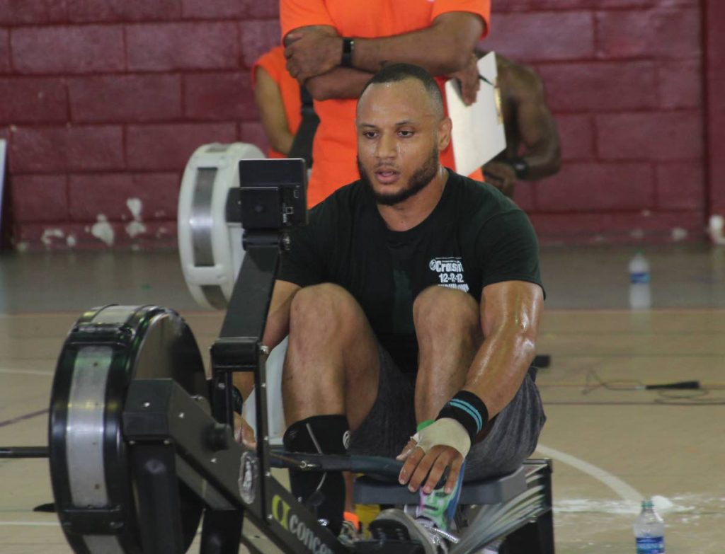Christian Mc Rae competes at the Rodney's Revolution CrossFit 12-12-12 International Throwdown at the Woodbrook Youth Facility.