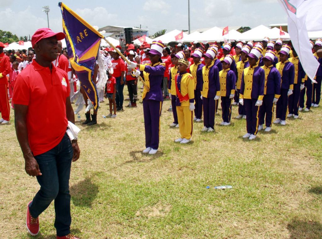 Prime Minister Dr Keith Rowley inspects the teams at the PNM Sports and Family Day at Edinburgh 500 Recreation Ground, Chaguanas on August 12. Rowley announced he will contest the party elections with a slate of candidates. PHOTO BY ANIL RAMPERSAD.