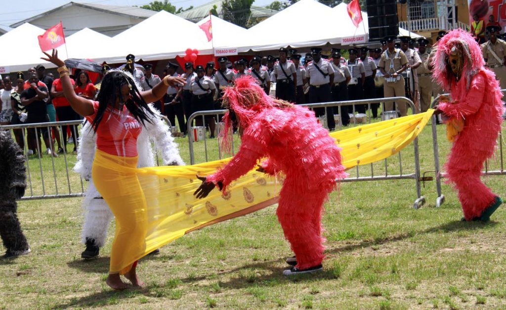 A group called the PNM guerillas unravelled the yellow sari from a suporter during part of an act at the PNM sports and family day march pass segment, which took place at the Edingburgh 500 Recreation Grounds, Chaguanas.
PHOTO BY ANIL RAMPERSAD.