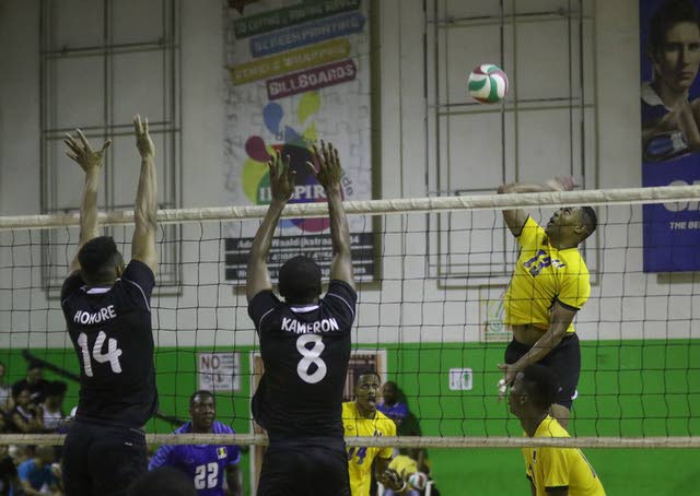 Barbados on the attack as TT's Marc Honore and Kameron Donald defend at the CAZOVA Championships in Suriname. 