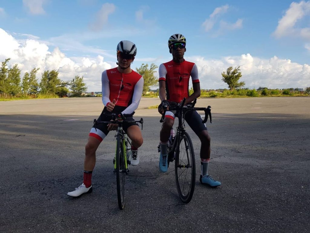 TT junior cyclists Enrique De Comarmond, left, poses with Tarique Woods. 