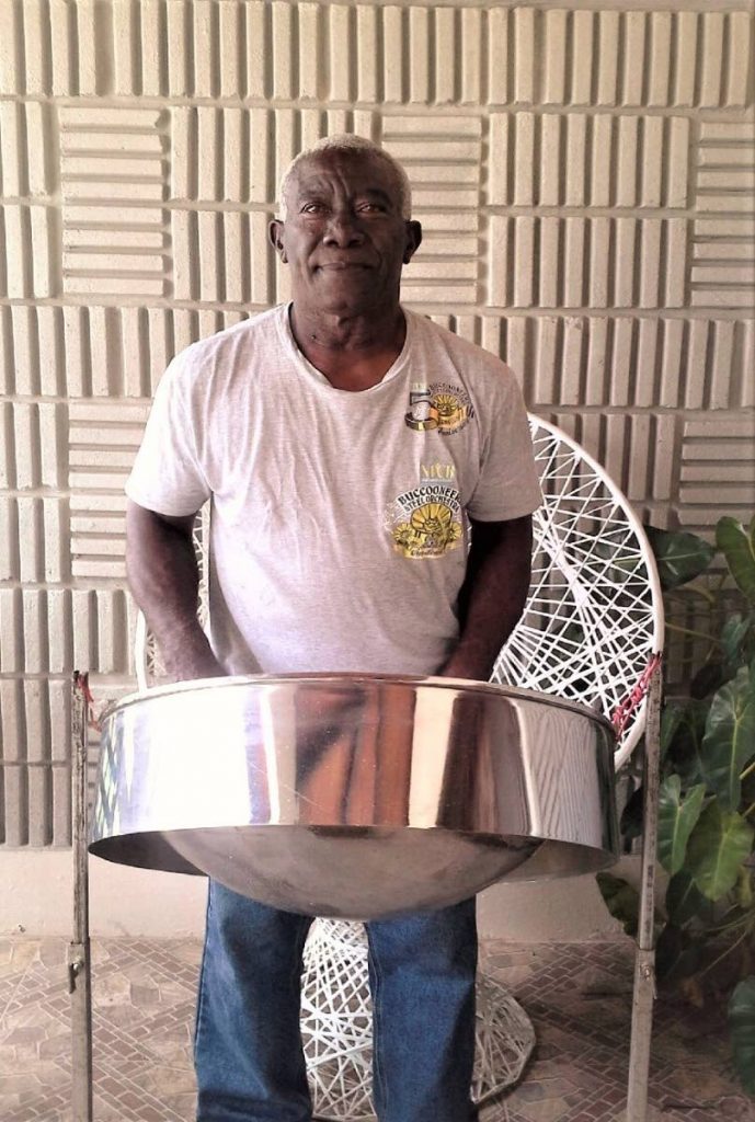 Allan Joseph, a founding member of the NLCB Buccooneers Steel Orchestra in Buccoo,poses for a photo with his tenor pan at his home in Lowlands. Photo by Emerline Gordon