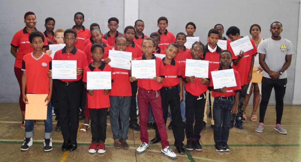 Participating students from the  Laventille Morvant Schools’ Improvement Project (LMSIP) football camp with their certificates of participation.