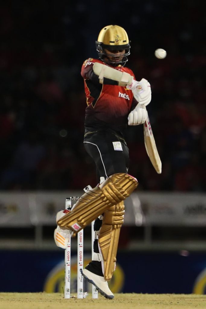 Sunil Narine of Trinbago Knight Riders dodges a short ball during the Hero Caribbean Premier League match between Trinbago Knight Riders and St Lucia Stars at Queen's Park Oval on August 8, 2018 in Port of Spain. 