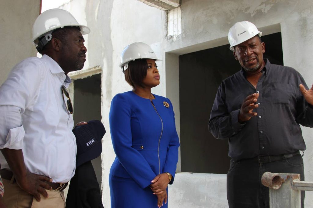 TTFA president David John-Williams, right, discusses the progress at the Home of Football site in Balmain, Couva on Monday with Sports Minister Shamfa Cudjoe, centre, and Veron Mosengo-Oba, FIFA director of Member Associations and Development for the Caribbean and Africa. PHOTO COURTESY THE MINISTRY OF SPORT AND YOUTH AFFAIRS