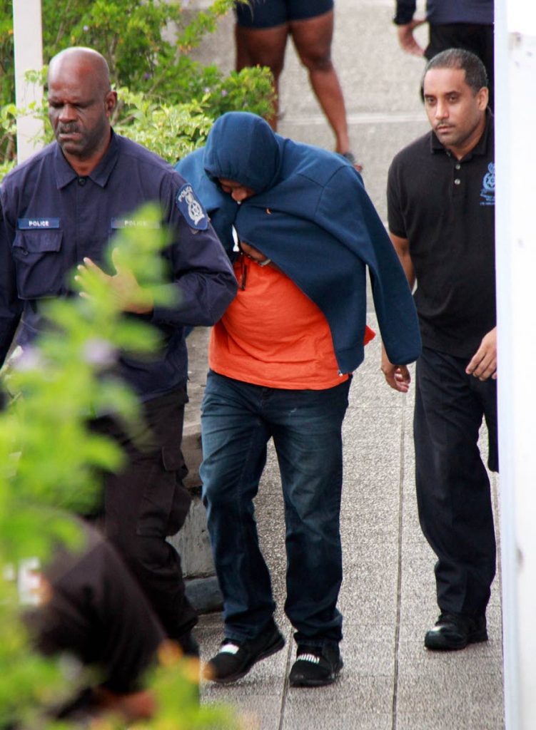 IN CUSTODY: PC Donald Snaggs leaves the San Fernando Magistrates’ Court after appearing on a charge of murder.