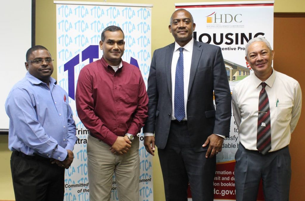 HDC and TTCA executive discuss housing construction incentives: HDC managing director Brent Lyons (third from left) and VP of TT Contractors Association Glenn Mahabirsingh (second from left) are flanked by (far left) the association's director Rodney Cowan and (far right) general manager John Cardenas. PHOTO COURTESY HDC.