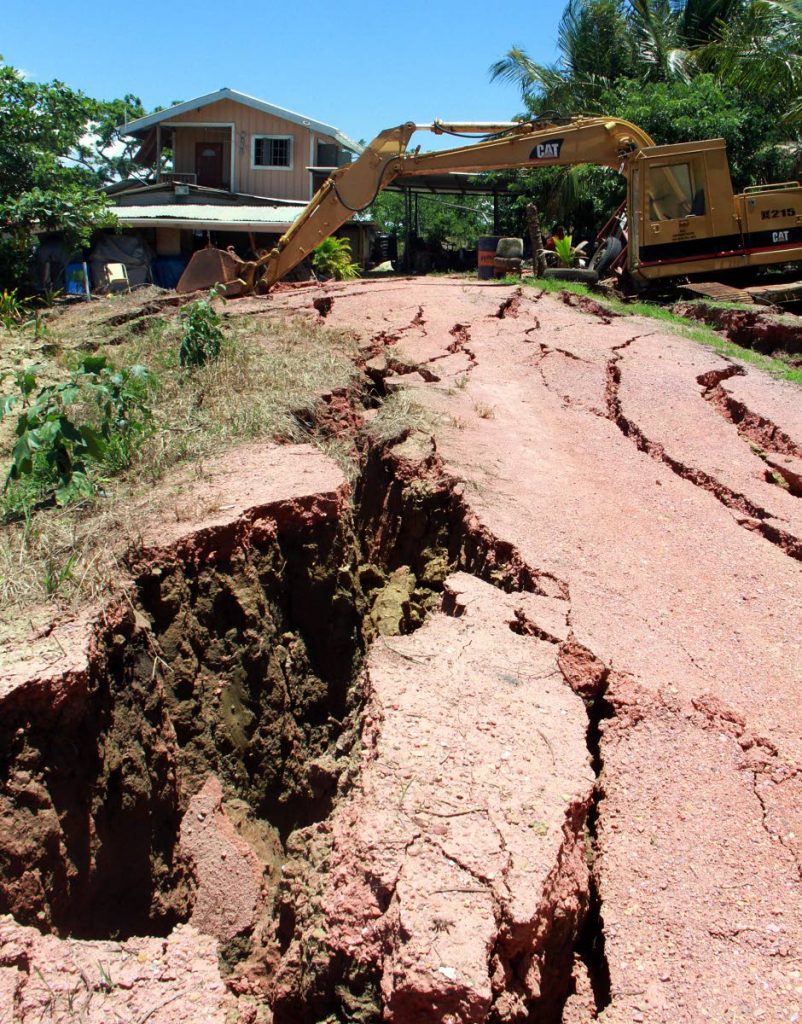 This home and excavator belongs to Nobbie Mathura which was damaged by the earthquake at Los Iros.
PHOTO BY ANIL RAMPERSAD.