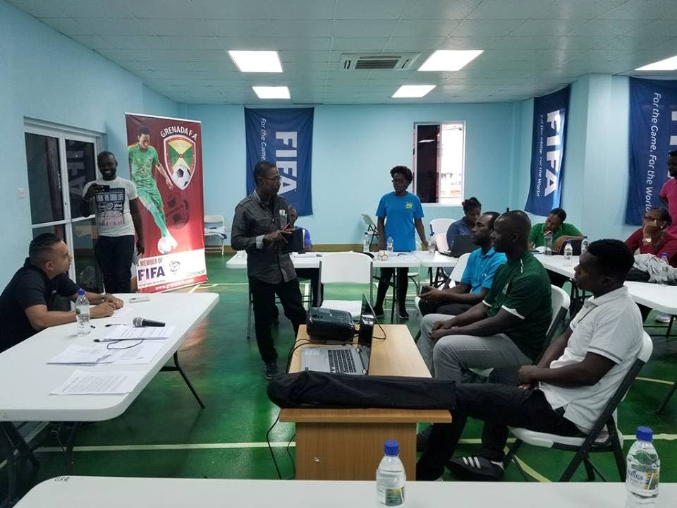 Stakeholders listen as a presentation is made at the recent Grenada FA media workshop. 