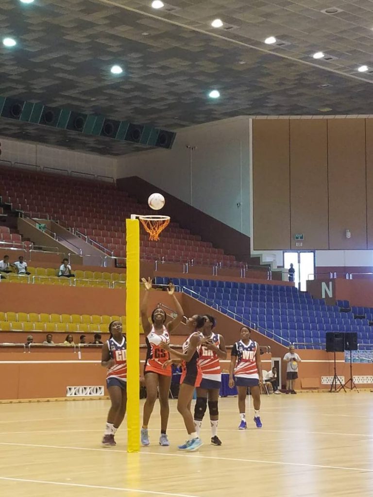 TT goalshoot Samantha Wallace scores a goal against USA in yesterday's 86-29 win at the AFNA Championships, Garfield Sobers Gymnasium, Barbados. 