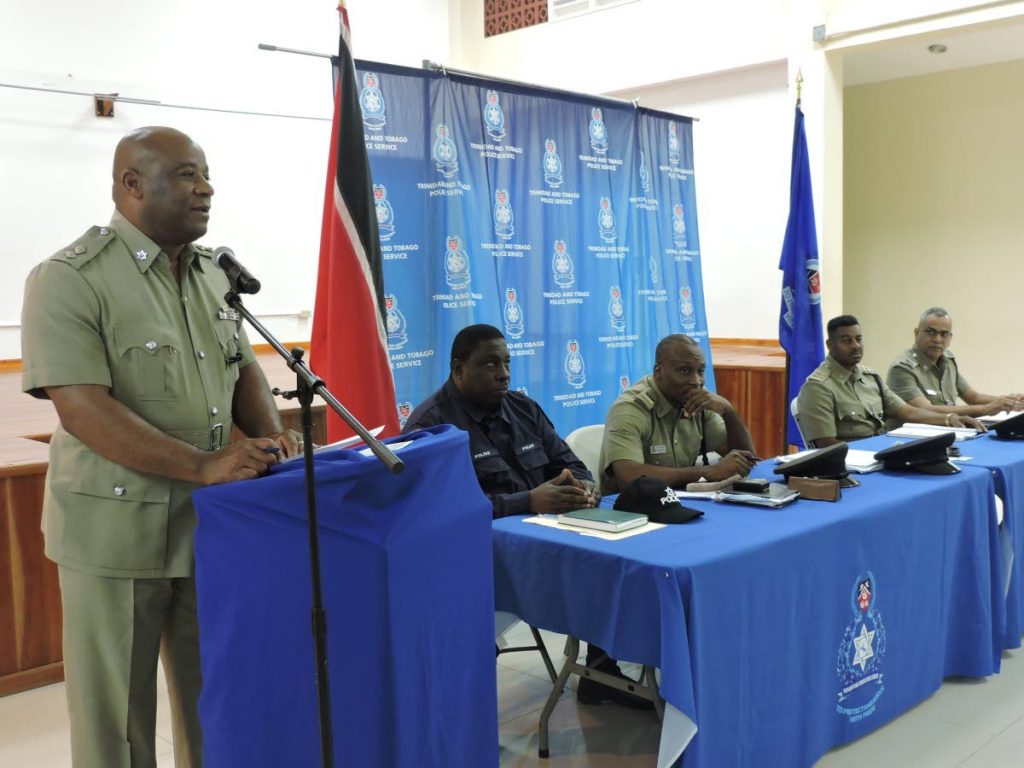 Commander, Tobago Division, ASP Richard Corbett, standing, engages with residents of Hope/Blenheim at last Wednesday’s TT Police Service town meeting held at the Hope Multi-purpose Facility.