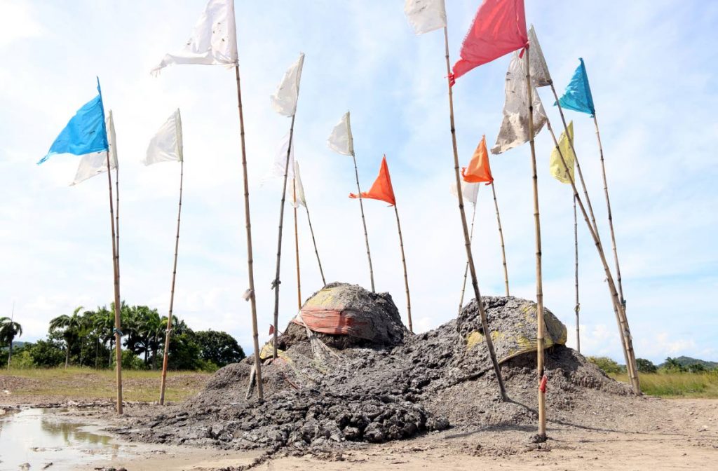 File photo: Flags, planted after Hindu prayers, flutter in the breeze at the Piparo mud volcano last year.