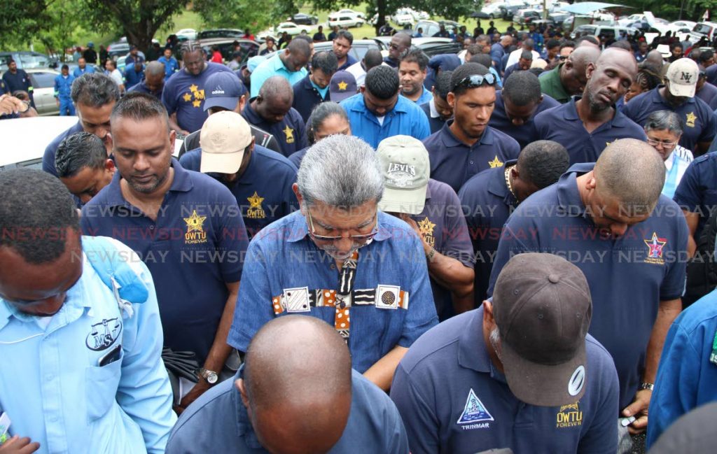 Members of the OWTU were seen at Beaumont Hill Pointe-a-Pierre in prayer yesterday after hearing the news that Petrotrin Management is prepared to send home 2500 workers PHOTO BY: ANSEL JEBODH 