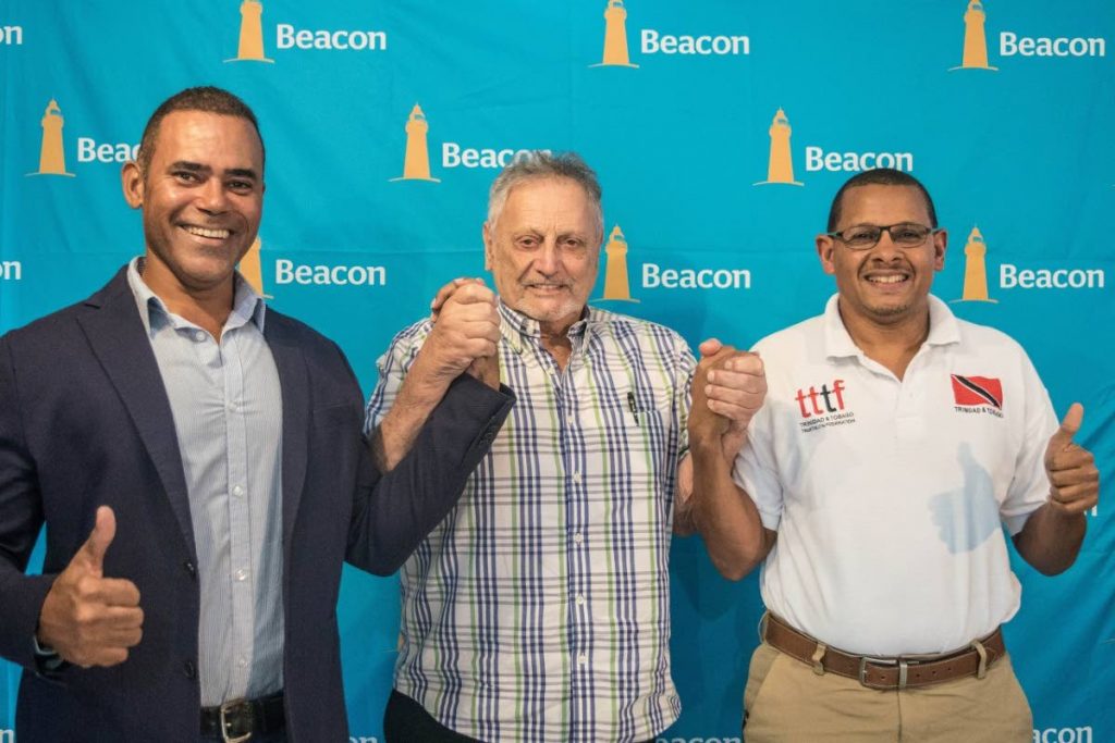 Michael Phillips of Phillips Promotions, from left, Gerald 
Hadeed, chief executive and CEO of Beacon and Paul Hee Houng,  president of the TT Triathlon Federation.