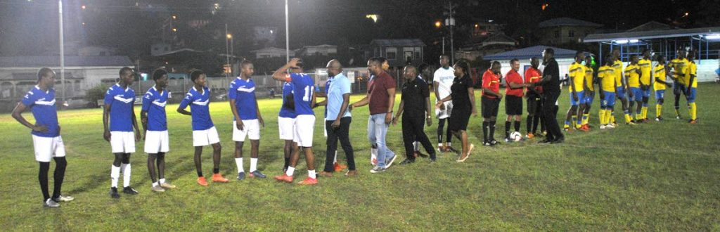 Officials meet players from TT Defence Force and Carenage All-Stars XI before an exhibition match at the launch of the 2018 Carenage All-Stars Football League on Saturday. Doing the honours are (from left) Adrian Winter, adviser to the Minister of Sport and Youth Affairs; Joel Primus, community sustainability and stakeholder relations adviser, BPTT; Bertrand Phillip, Vice President, Carenage All-Stars Football League; and Nicola Johnson-Williams, treasurer.


