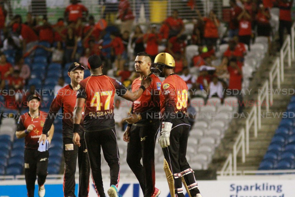Trinbago Knight Riders celebrate after Sunil Narine (second from right) takes a wicket in the semifinals of the Caribbean Premiere League. Photo by Anil Rampersad