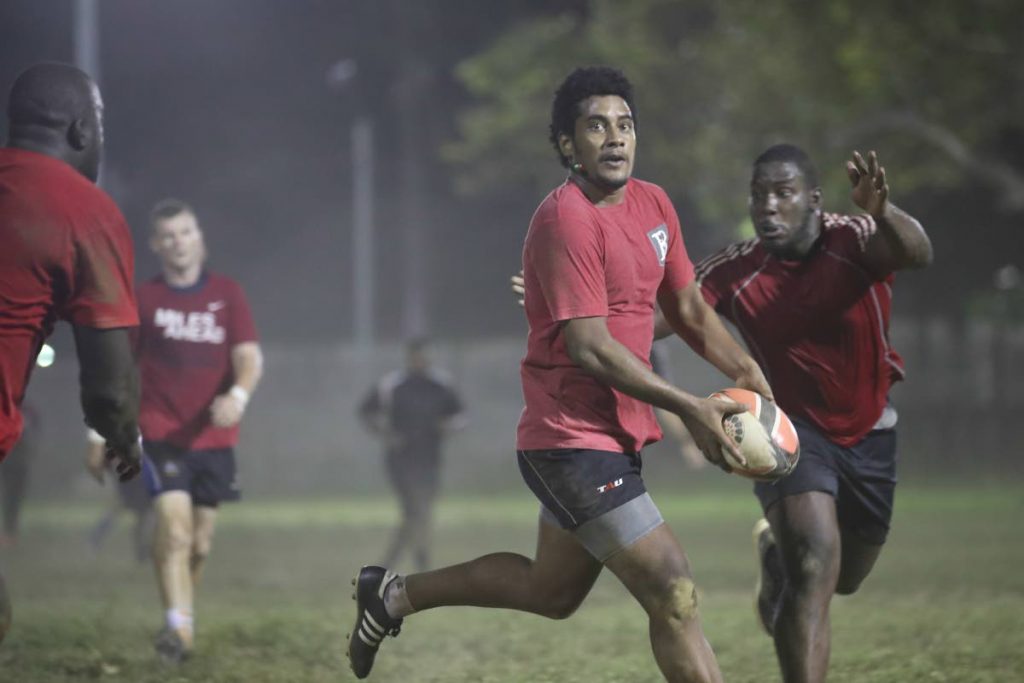 FLASHBACK: Fiji-born Sefanaia Waqa runs with the ball during a national training session earlier this year. Waqa is on the TT  team currently competing at the Rugby Americas North Sevens Championship in Barbados. PHOTO BY ALLAN V CRANE/CA-IMAGES 