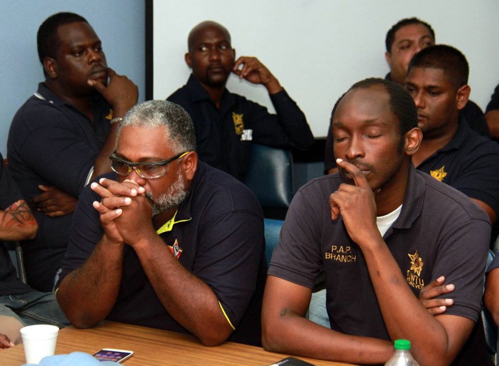 OWTU members and employees of the refinery in a sombre mood during a press conferene at OWTU headquarters, San Fernando last Thursday. PHOTO BY ANIL RAMPERSAD.