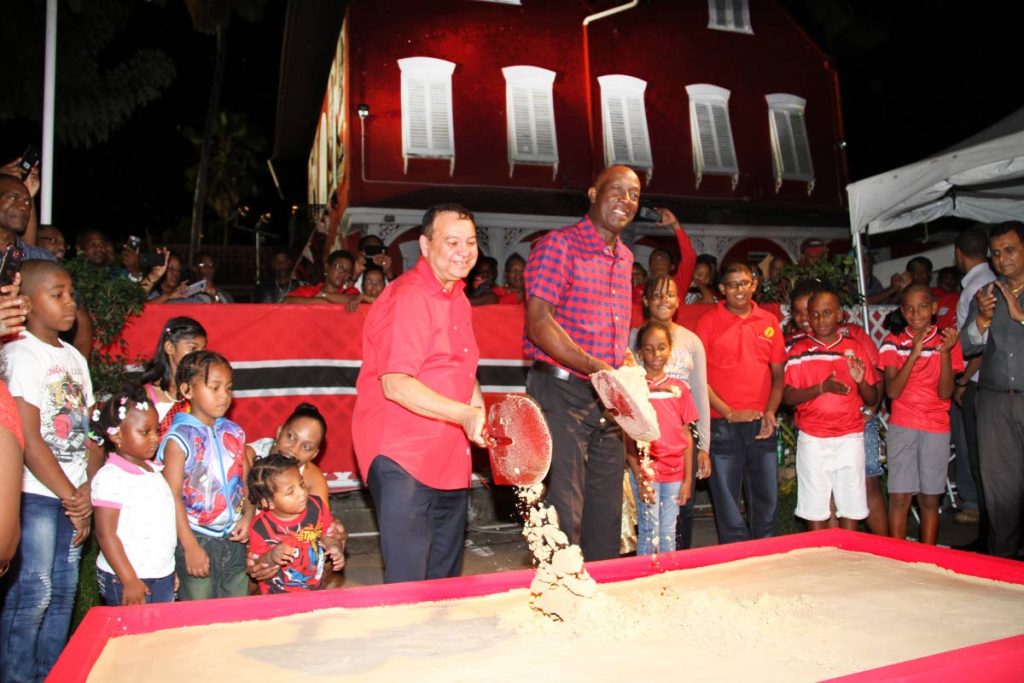 TIME TO REBUILD: PNM leader and Prime Minister Dr Keith Rowley, along with PNM chairman Franklin Khan, turn the sod for the construction for a new Balisier House at Tranquillity Street, Port of Spain on Thursday. PHOTO BY SUREASH CHOLAI
