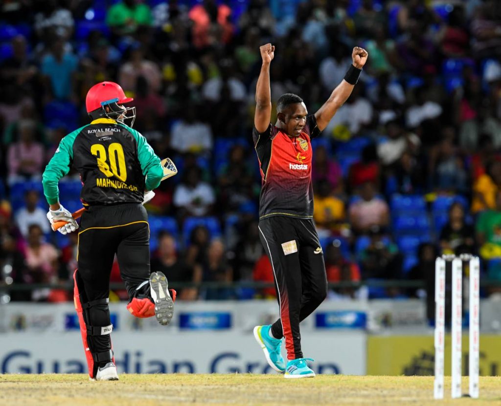 Mahmudullah (L) of St Kitts & Nevis Patriots attempts a run as Dwayne Bravo (R) of Trinbago Knight Riders celebrates winning match 23 of the Hero Caribbean Premier League between St Kitts & Nevis Patriots and Trinbago Knight Riders at the Warner Park Sporting Complex, on Saturday, in Basseterre, St Kitts.
