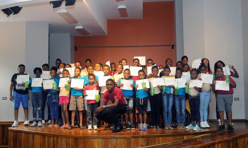 Participants pose with their certificates at the Betsy’s Hope Multi-purpose Facility on August 24 after completing the Division of Tourism’s Summer Youth Awareness programme.