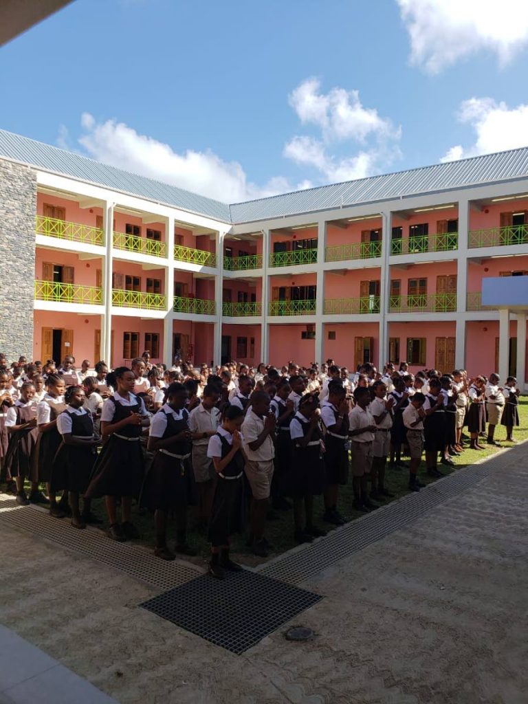 Students of the Scarborough RC school stand in the quadrangle for morning worship on the first day o the new school term on Monday. The newly built school at Smithfield was commissioned last week by Chief Secretary Kelvin Charles, who is also Secretary of Education. 