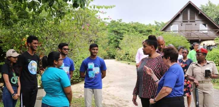 Vice president of the Wildfowl Trust  Karilyn Shephard introduces President Paula Mae-Weekes to the trust's Tamara Goberdhan and some interns who are UWI students learning more about the natural environment as well as doing some volunteer work.