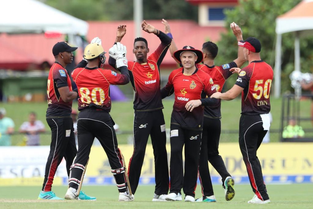 Trinbago Knight Riders spinner Khary Pierre, centre, celebrates a wicket during a Hero Caribbean Premier League match vs Jamaica Tallawahs earlier this season. PHOTO BY CPL T20 
