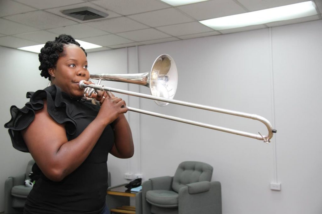Kensa Thomas-James plays the trombone in the Police Service band. 
PHOTOS BY SUREASH CHOLAI

