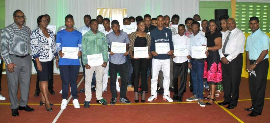 Graduates of the 2018 BPTT Mathematics is Fun programme  at the YTC. Sharing the moment are  Andrew Cross, principal consultant, Cross & Associates, left; Ronda Francis, corporate responsibility, BPTT; and  from right are Rajkumar Ramroop, Prisons supervisor - programme and industry; and Krishna Bedassie, officer-in-charge (programme), YTC.