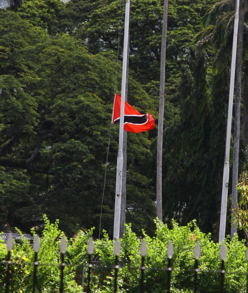 UPSIDE DOWN: The national flag is lowered by guards at President’s House after it was pointed out to the sentry at the southern gate that it was flying upside down. PHOTO BY ROGER JACOB