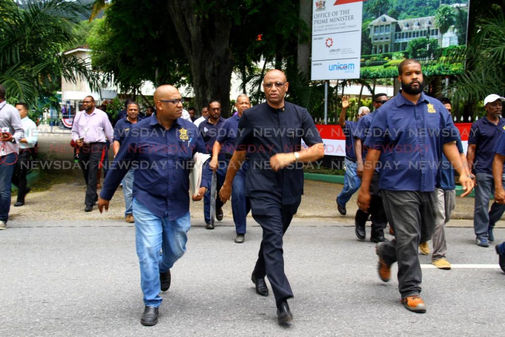 File photo: Ancel Roget, President of OWTU, accompanied with Ozzi Warwick and escorted by WOII Paul Voisin, OWTU Education and Research Officer to Offfice of the President, St Anns POS. September 10, 2018. PHOTO BY ROGER JACOB  