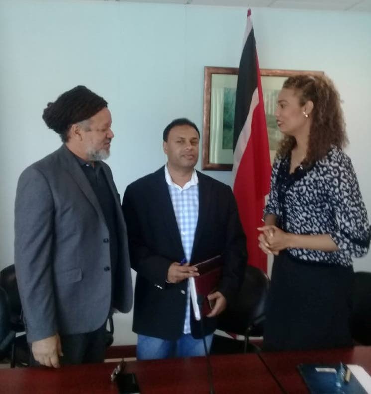 United National Congress Deputy Political Leader Khadijah Ameen (right) chats with Vega De Oropouche councillor Anil Juteram (centre) and chairman of the Couva/Tabaquite/Talparo Regional Corporation Henry Awong following a media conference on Sunday at the Office of the Opposition Leader, Port of Spain. 