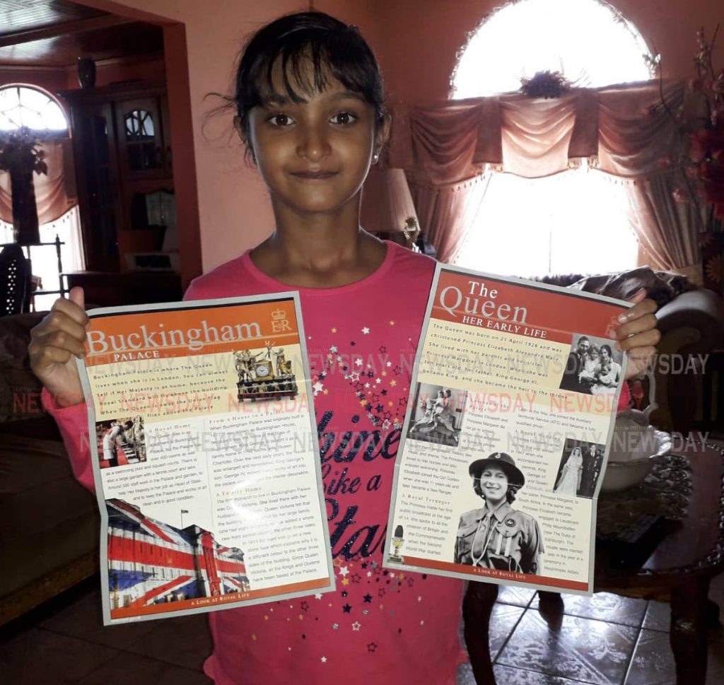Anisha Rampersad, nine, displays two brochures sent to her by Queen Elizabeth 11, of Buckingham Palace.
PHOTO BY ANIL RAMPERSAD.