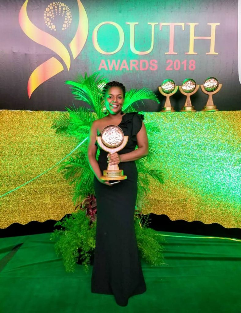 Rheanne Moore, leader of the Charlotteville Police Youth Club, poses with her National Youth Award for Leadership and Advocacy at the Hyatt Regency in Trinidad last Saturday. 