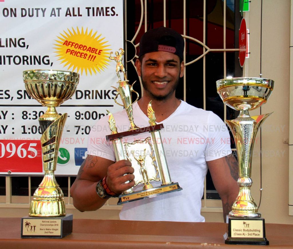 Doublesman Rasheed Ali of Rio Claro shows off his trophies after entering several  body building competitions 
PHOTO BY ANIL RAMPERSAD.