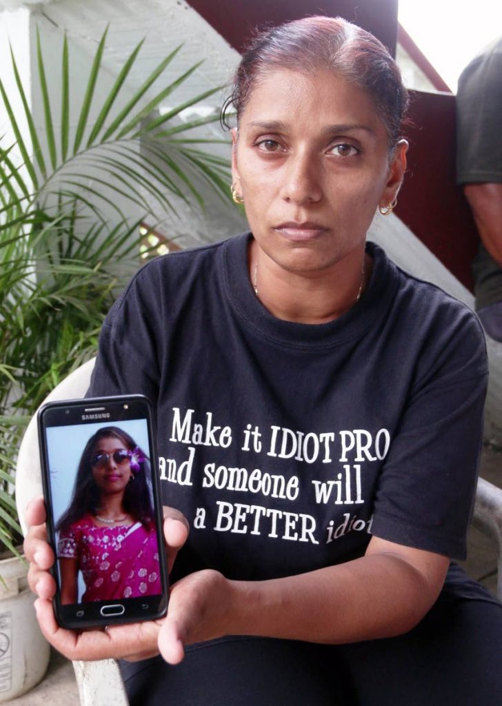 SHE’S MISSING: Sandra Khan displays a cellphone photo of her daughter Shanaez Khan who went missing on Wednesday.