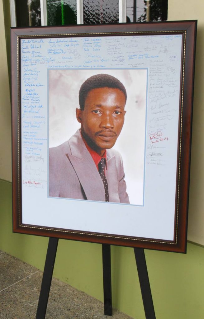
Signatures of Andre Alexander's friends were written on a condolence photograph.