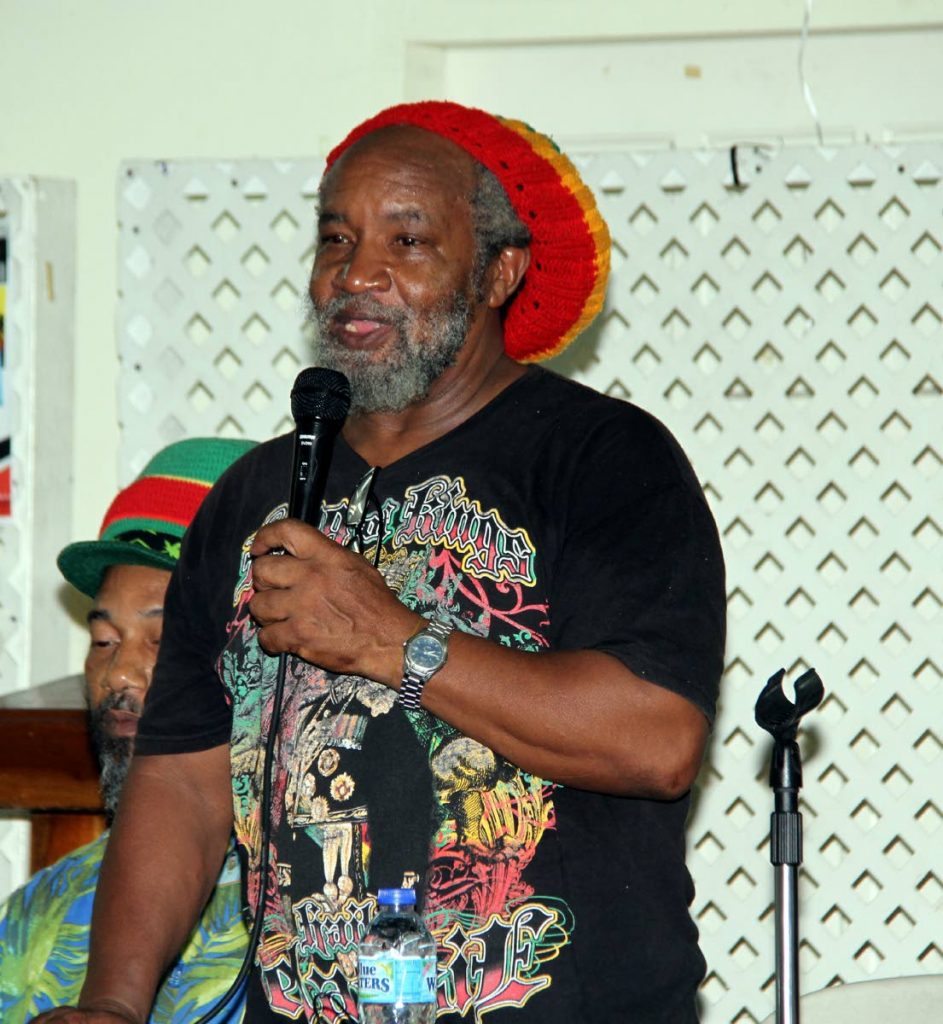 LEGALISE IT: Clyde Noel, represenative of All Mansions of Rastafari, speaks during a symposium on the legalisation of marijuana held on Thursday night at the Communication Workers Union headquarters, Henry Street, Port of Spain. 