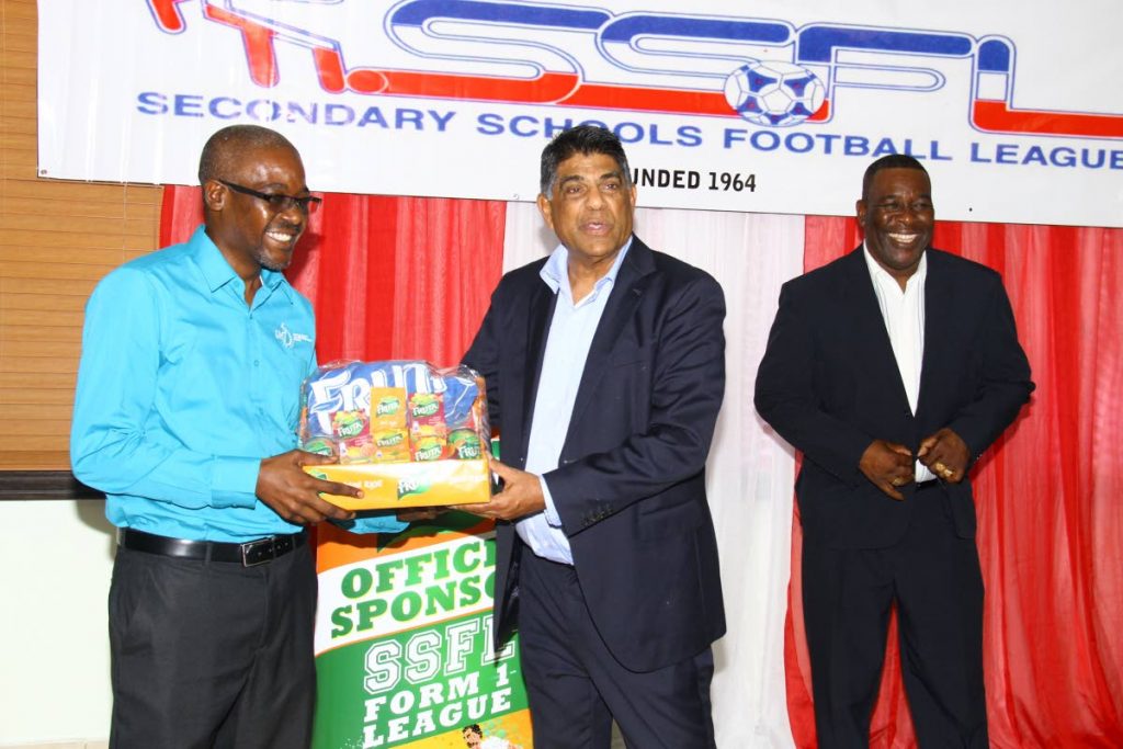 All Sports Promotions director Anthony Harford, centre and William Wallace,(R) President of SSFL, at the offical launch,yesterday, of the ‘From 1 Schools League’ hosted by Secondary Schools Football League, President Box, Queen’s Park Oval, POS.