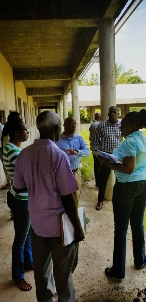 Minister in the Ministry of Education Lovell Francis in discussions with officials and members of the Fanny Village Government Primary school Parents Teachers Association on Friday.