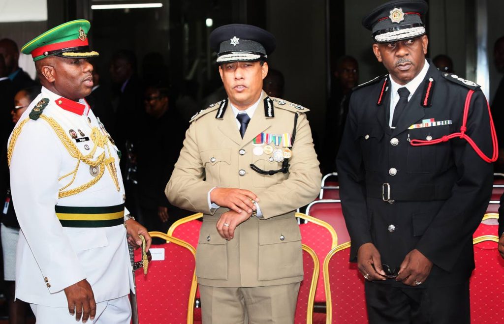 TOP SECURITY MEN: Commissioner of Police Gary Griffith is seen yesterday at the ceremonial opening of the Law Term at the Hall of Justice in Port of Spain flanked by Ag Chief of Defense Staff Darnley Wyke, left, and Chief Fire Officer Roosevelt Bruce.