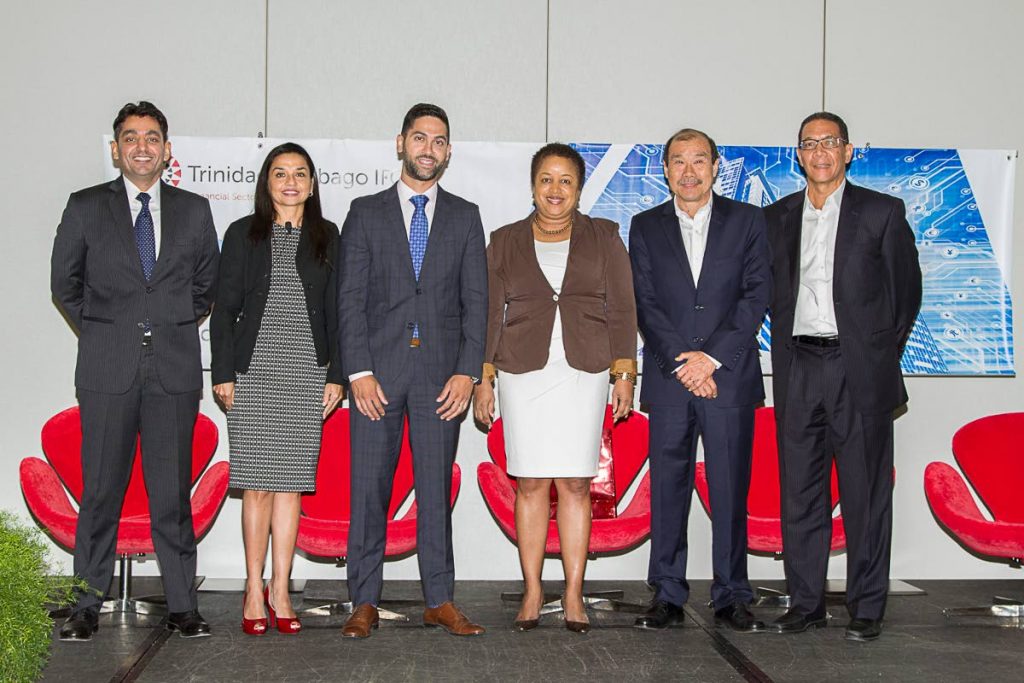 The panel of speakers at the TT IFC engagement session on FinTech at the Hyatt Regency. From left, associate director EY, Singapore Varun Parmar, EY partner Trinidad Maria Daniel, TT IFC CEO, Omar Sultan-Khan, Minister in the Ministry of Finance Allyson West and TT IFC chairman Richard Young.