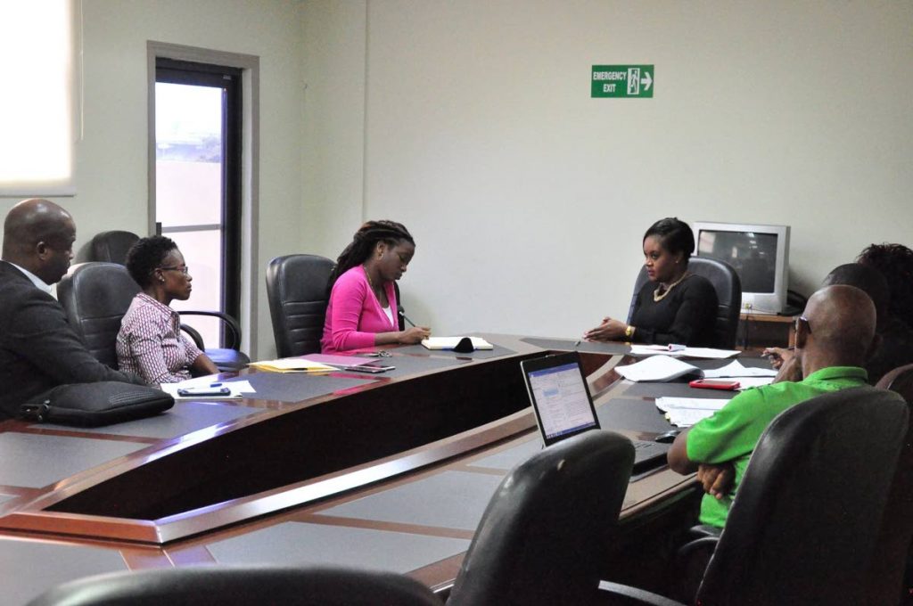Jinelle James (second from left) and TTFA general secretary Justin Latapy-George during a meeting with Sports Minister Shamfa Cudjoe (centre) at the Ministry’s office on Friday. PHOTO COURTESY MINISTRY OF SPORT AND YOUTH AFFAIRS.